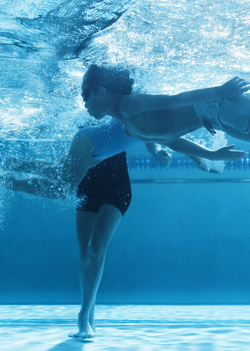 a girl holding her breath under water