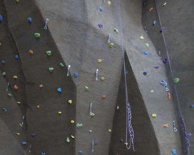 Indoor climbing wall with colorful pegs