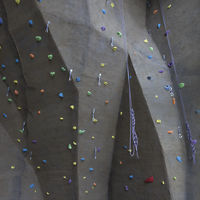 Indoor climbing wall with colorful pegs