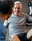 Male participants talking during a group training session