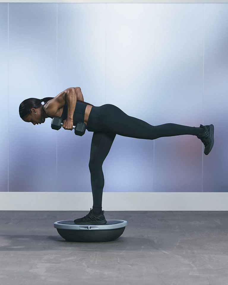 a woman in a single leg pose