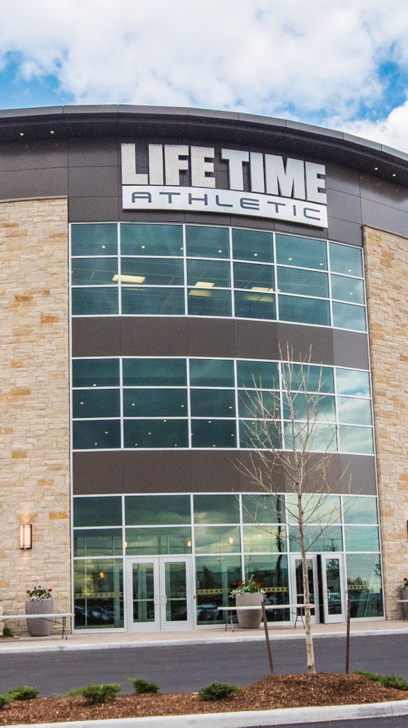 The exterior and front enterance of a Life Time location