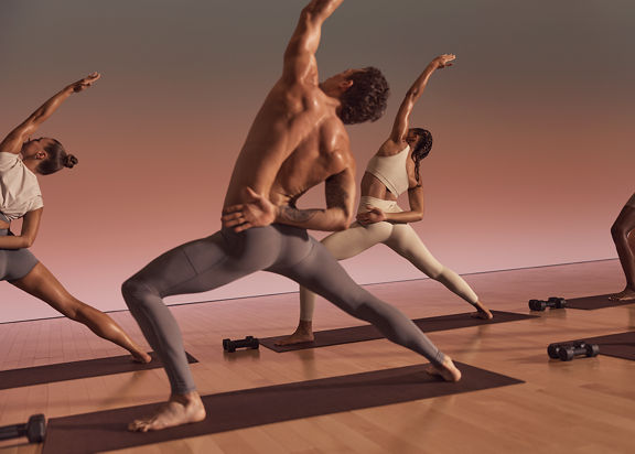 five people doing a warrior pose