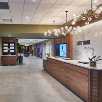 Lobby and reception desk area at Life Time Studio The Shops at Riverside