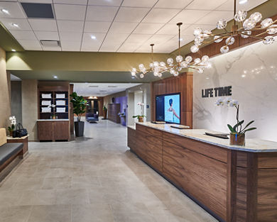 Lobby and reception desk area at Life Time Studio The Shops at Riverside