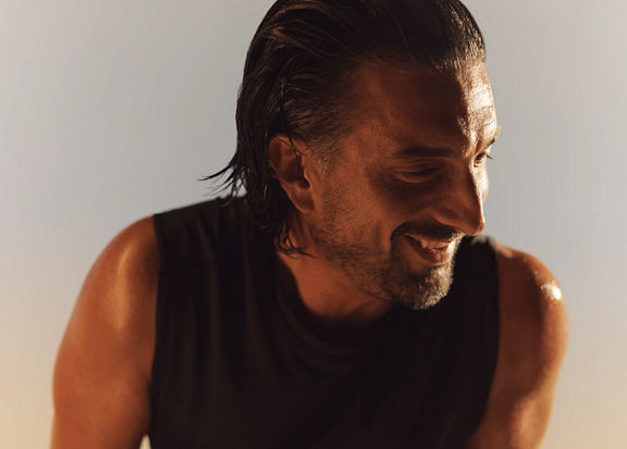 Life Time member sweaty and happy after an Xtreme cardio class