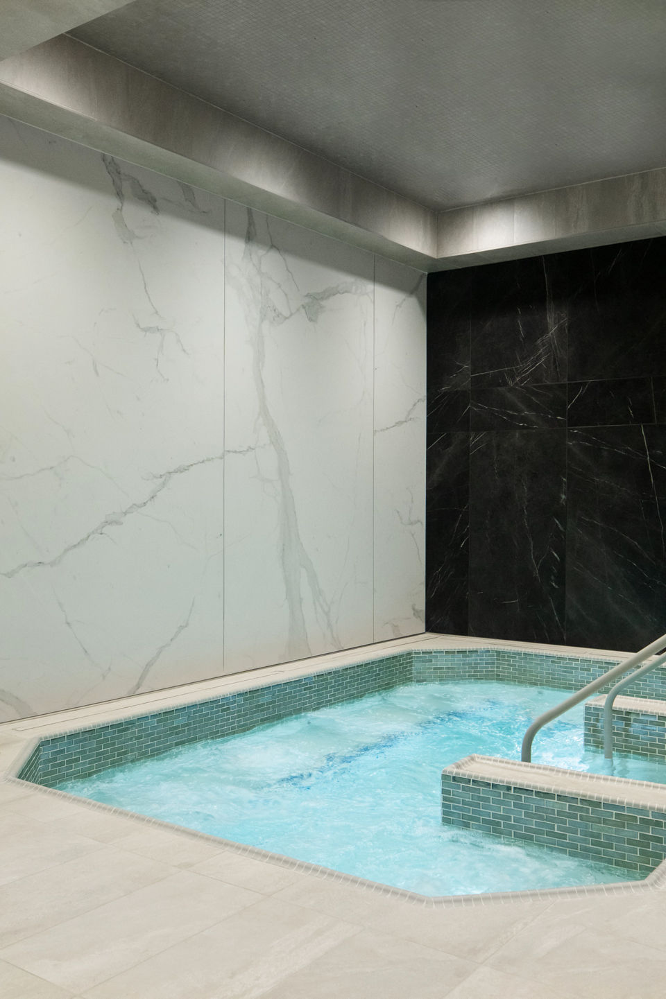 Indoor whirlpool with tiled granite walls