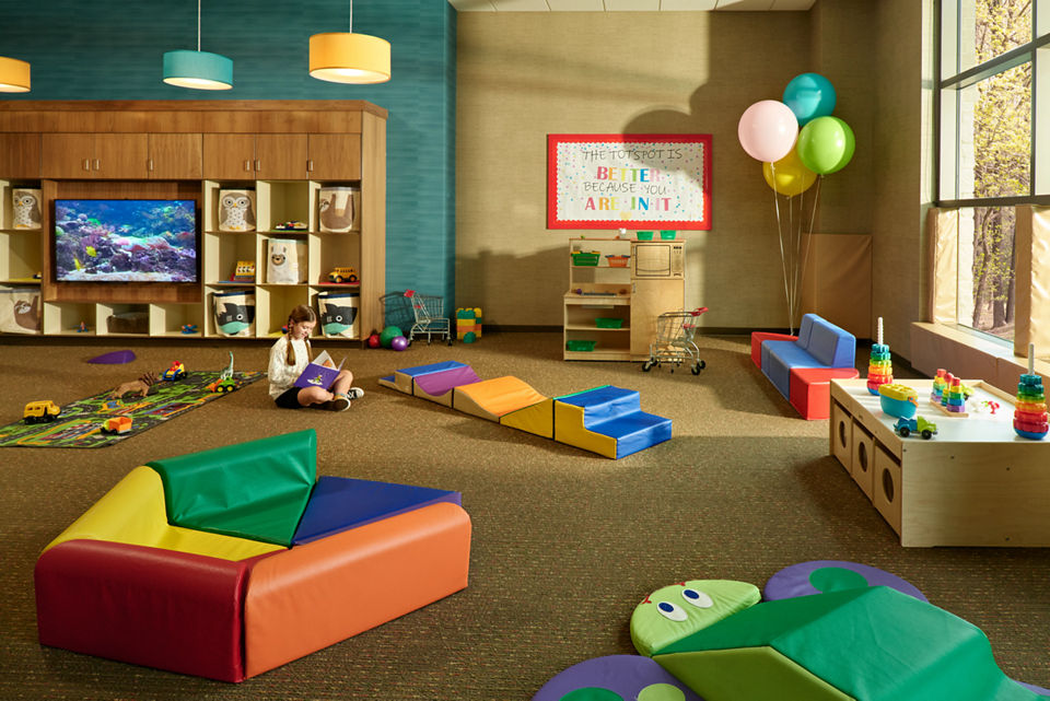 Toddler area with brightly colored toys in a Life Time Child Center