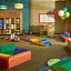 Toddler area with brightly colored toys in a Life Time Child Center