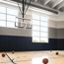 Basketball court with basketballs scattered on the floor