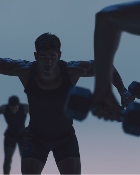 Maxout strength class featuring a group of people working out with barbells