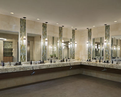 marble tile and glass sink area, with large mirrors