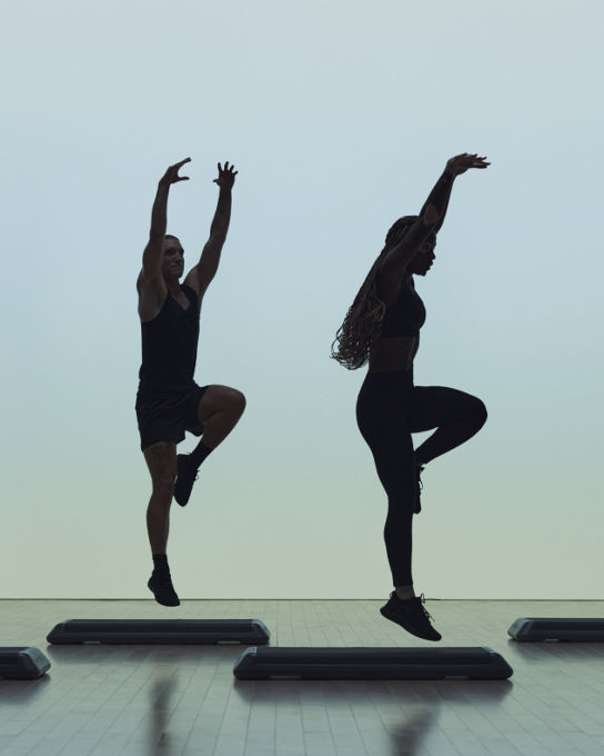 Remixx cardio dance class featuring silhouettes of people arms extended overhead in dance